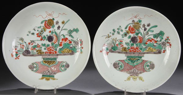 PAIR OF CHINESE DOUCAI KANGXI PORCELAIN BOWLS: A PAIR OF CHINESE DOUCAI DECORATED PORCELAIN BOWLS, QING DYNASTY, KANGXI MARK AND OF THE PERIOD. Enameled with floral basket decoration within gently sloping sides, each marked with casual brushed lea