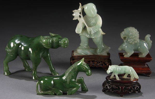FIVE CHINESE CARVED JADE FIGURES, 19TH/20TH CENT: FIVE CHINESE CARVED JADE FIGURES, 19TH/20TH CENTURY. Comprising a very fine celadon colored foo dog, an immortal with lotus, a diminutive horse and a green nephrite horse and water buffalo. Height 1.5