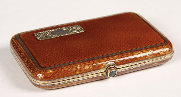 CONTINENTAL SILVER GILT CIGARETTE CASE: A CONTINENTAL SILVER GILT AND GUILLOCHE ENAMEL CIGARETTE CASE, FIRST HALF OF THE 20TH CENTURY. Butterscotch translucent enamel over an engine turned ground, with gold mounted cabochon thumbpiece. The 