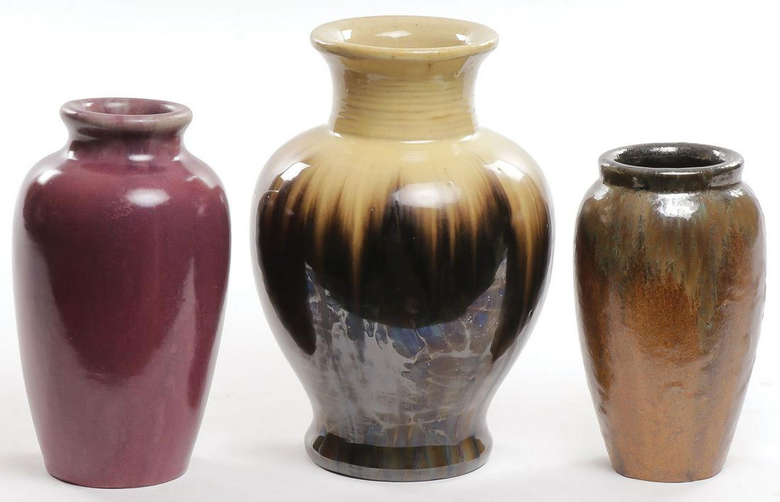 THREE FULPER VASES: THREE FULPER VASES. The largest with yellow neck and shoulders and dark green body with incised mark on underside of base and partial original Fulper label. Together with a mulberry colored vase with
