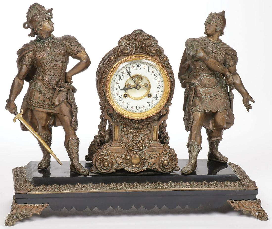 IMPRESSIVE WARRIOR FIGURAL MANTEL CLOCK C. 1900: IMPRESSIVE WARRIOR FIGURAL MANTEL CLOCK C. 1900. Comprising a large and impressive mantel clock, the rectangular base with ornate trim in faux marble supporting a central clock with scroll decorated c