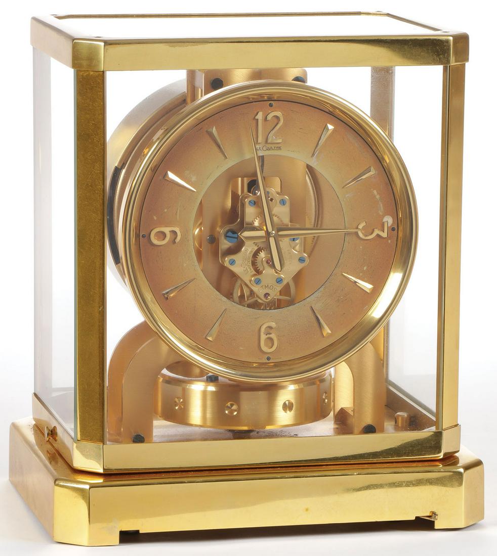 SWISS ATMOS LECOULTRE CLOCK: SWISS ATMOS LECOULTRE CLOCK. Of traditional form in brass case on stand. Serial number 35429. Height 9.25 inches. SHIPPING NOTICE: Jackson's is your sole and only source for one stop packing and s