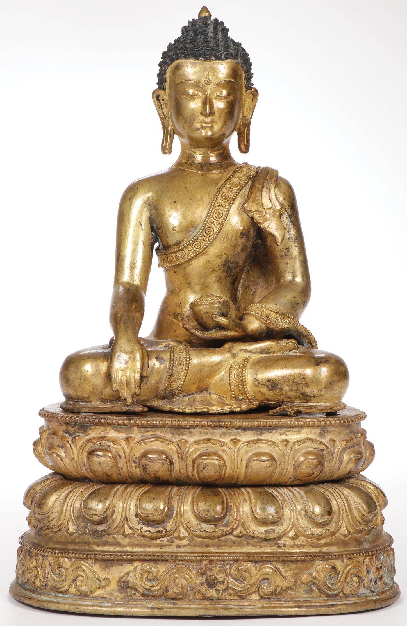 SINO-TIBETAN GILT BRONZE BUDDHA: SINO-TIBETAN GILT BRONZE BUDDHA. Resting on a double lotus base upon which rests a finely sculpted Buddha with long earlobes and snail shell curls. Underside of base sealed and incised with single