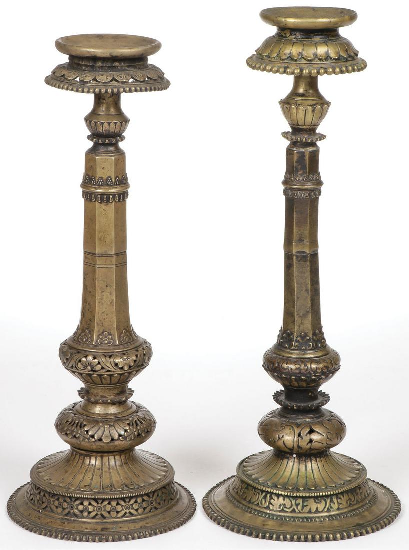 PAIR OF BRONZE TIBETAN TEMPLE LAMP STANDS 19TH C: PAIR OF BRONZE TIBETAN TEMPLE LAMP STANDS 19TH C. Of ornate pierced design with concave platform at top of surface. The tallest example detached above the center node. Greatest height 19.25 inches (49