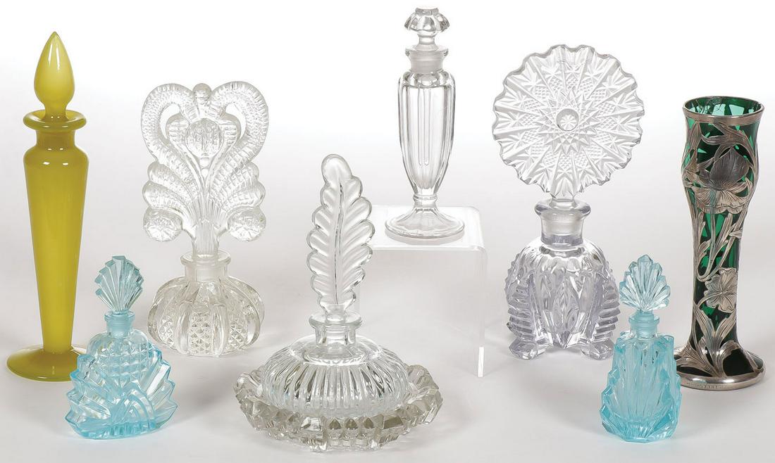 SEVEN VINTAGE GLASS PERFUMES: SEVEN VINTAGE GLASS PERFUMES. Comprising seven individual perfume bottles including a scarce Steuben yellow jade perfumer with original stopper and partial paper label (height including stopper 7.5 in