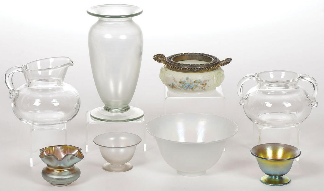 AMERICAN ART GLASS GROUP STEUBEN AND OTHER: AMERICAN ART GLASS GROUP STEUBEN AND OTHER. Comprising eight individual pieces, including a footed urn shaped vase with ground pontil, apparently unmarked but likely Steuben, a white Steuben iridized