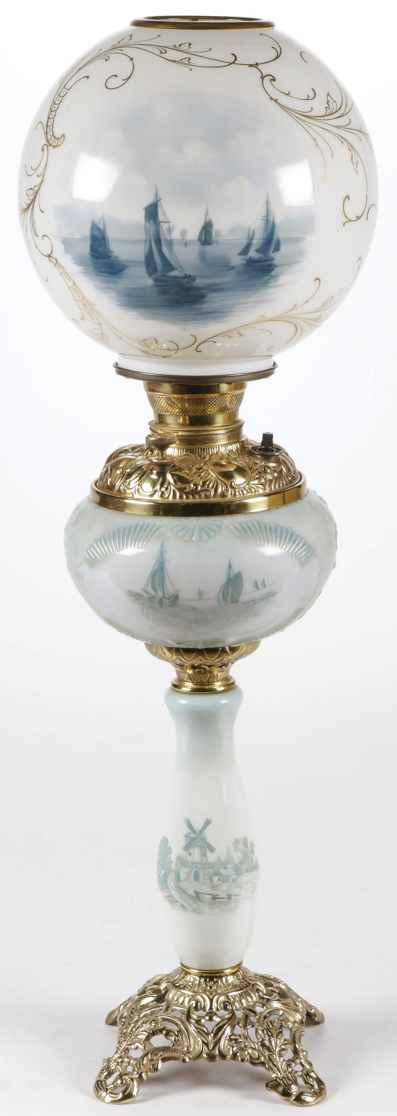 SCARCE DUTCH PARLOR LAMP: SCARCE DUTCH PARLOR LAMP. With opaque baluster base and blown out oil font reserve and matching shade depicting sailboats in harbor. Electrified. Height 28 inches. SHIPPING NOTICE: Jackson's is yo