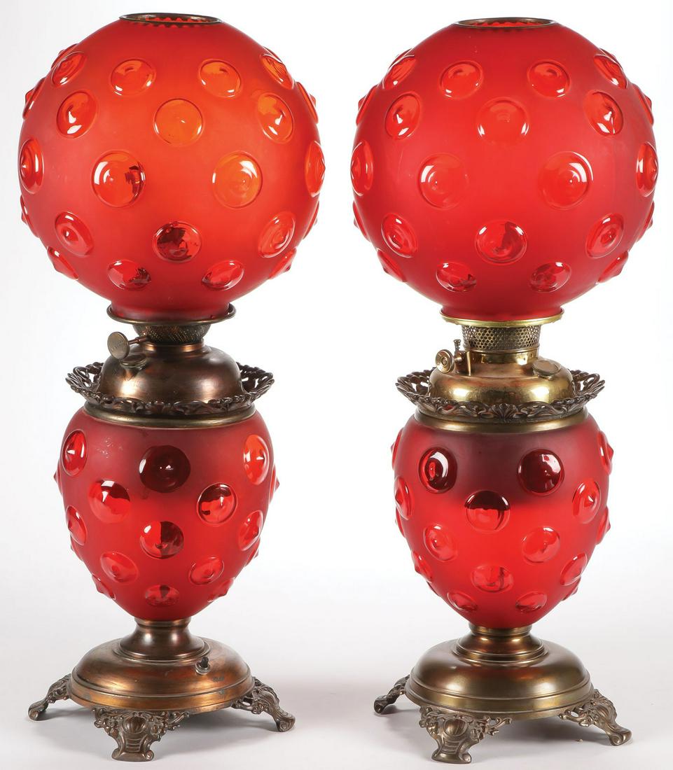 VINTAGE PAIR GONE WITH THE WIND LAMPS, C. 1910: VINTAGE PAIR GONE WITH THE WIND LAMPS, C. 1910. Comprising a beautiful pair of Pittsburgh Lamp Company double globe lamps in red satin glass bullseye pattern. One electrified. Matching bases and colla