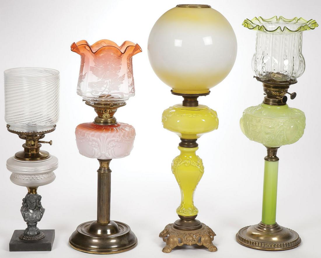 FOUR VINTAGE PARLOR LAMPS: FOUR VINTAGE PARLOR LAMPS. Comprising four likely consolidated or blown out mold lamps in yellow, Vaseline and Amberina with corresponding colored shades. Each electrified. And a zinc bust pedestal pa