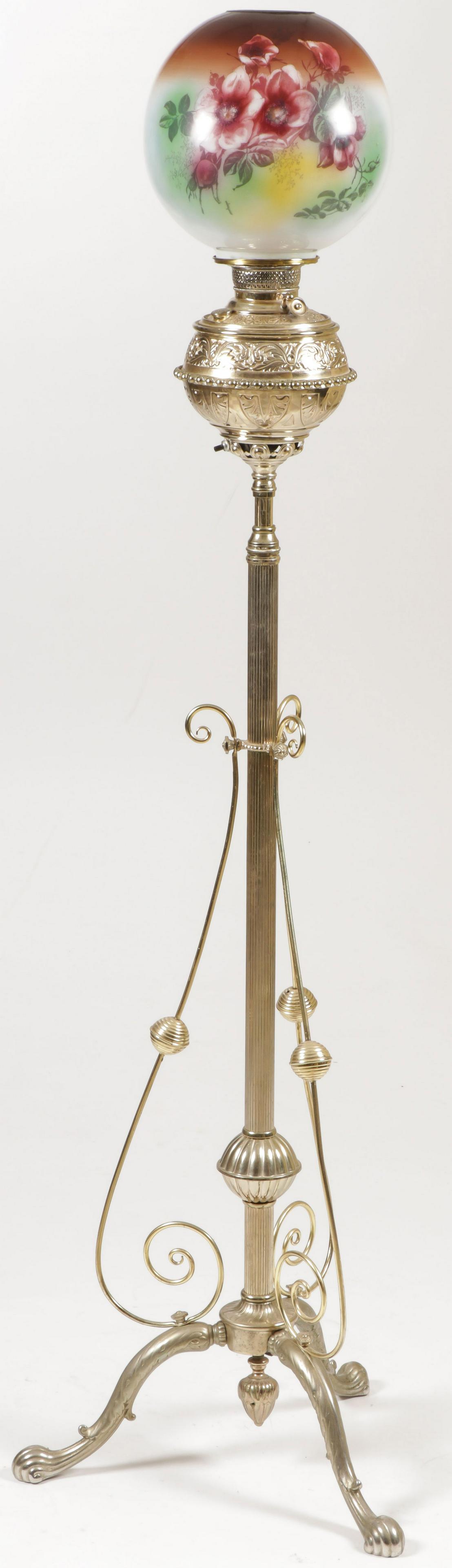 VICTORIAN BRASS ORGAN FLOOR LAMP: VICTORIAN BRASS ORGAN FLOOR LAMP. Three footed base with adjustable fluted column, brass font, and floral decorated shade. SHIPPING NOTICE: Jackson's is your sole and only source for one stop pack