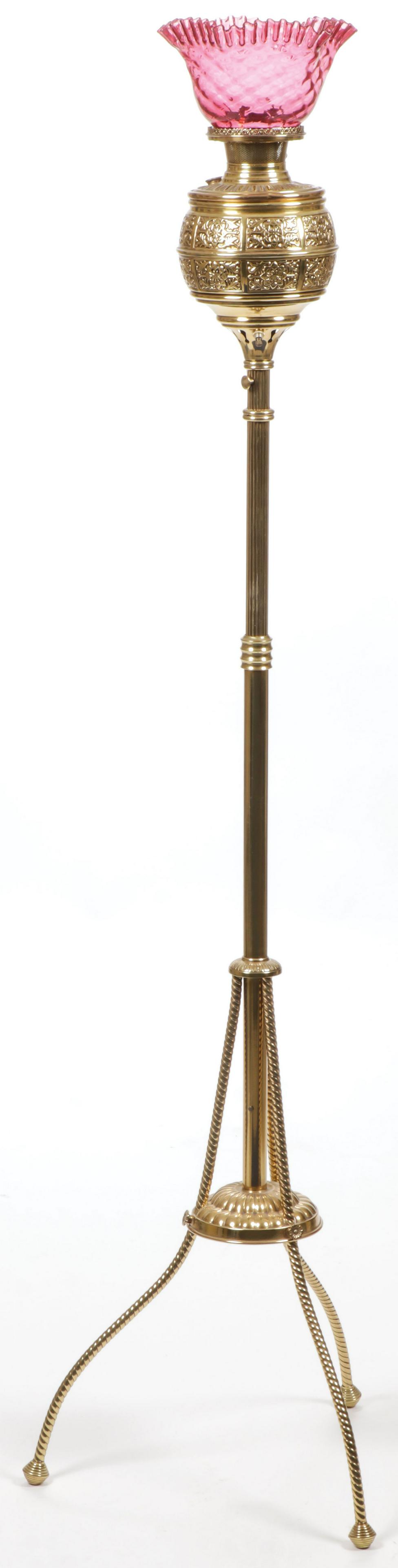 BRASS VICTORIAN ORGAN LAMP: BRASS VICTORIAN ORGAN LAMP. Comprising a polished brass adjustable organ lamp with cranberry diamond quilted shade with ruffled rim, electrified. Overall height 65 inches. SHIPPING NOTICE: Jackson