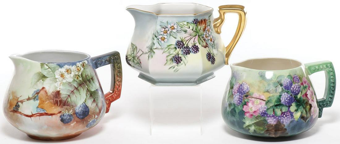 THREE HAND-PAINTED BLACKBERRY CIDER PITCHERS: THREE HAND-PAINTED BLACKBERRY CIDER PITCHERS. The first Bavarian and artist signed K.B. Hensler, the second marked B&C Limoges France and the third on a CAC Belleek blank. Greatest height 6.25 inc