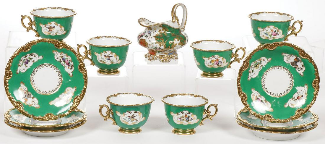 JACOB PETIT FRENCH PORCELAIN SET: JACOB PETIT FRENCH PORCELAIN SET. Comprising six matching cups and saucers with gilt decoration and hand-painted flowers. Underside with blue underglaze mark J.P. for Jacob Petit. Together with a