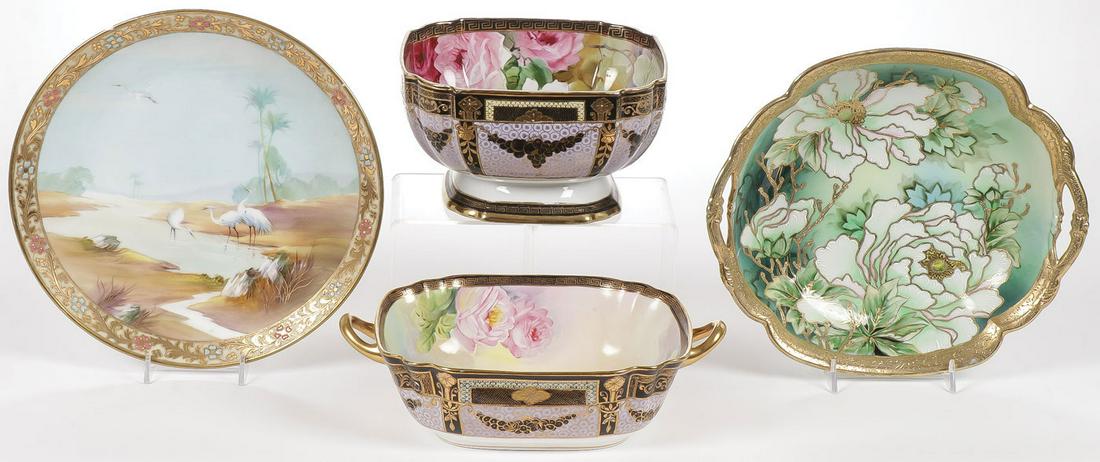 FOUR HAND-PAINTED NIPPON BOWLS: FOUR HAND-PAINTED NIPPON BOWLS. Each beautifully decorated with gilt raised highlights including a finely painted charger depicting cranes in a desert landscape, various marks. Greatest measuremen