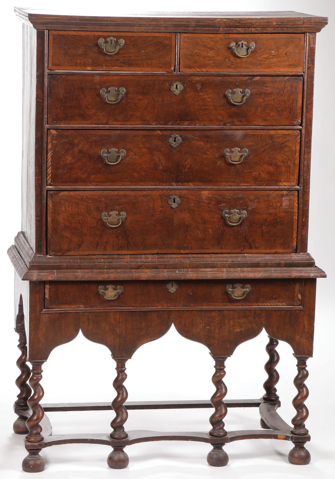 AN ENGLISH WILLIAM AND MARY CHEST ON STAND: AN ENGLISH WILLIAM AND MARY CHEST ON STAND C. 1720. Having a molded cornice, the upper chest fitted with five drawers on stand with one full length drawer, scalloped apron, serpentine stretcher, and b