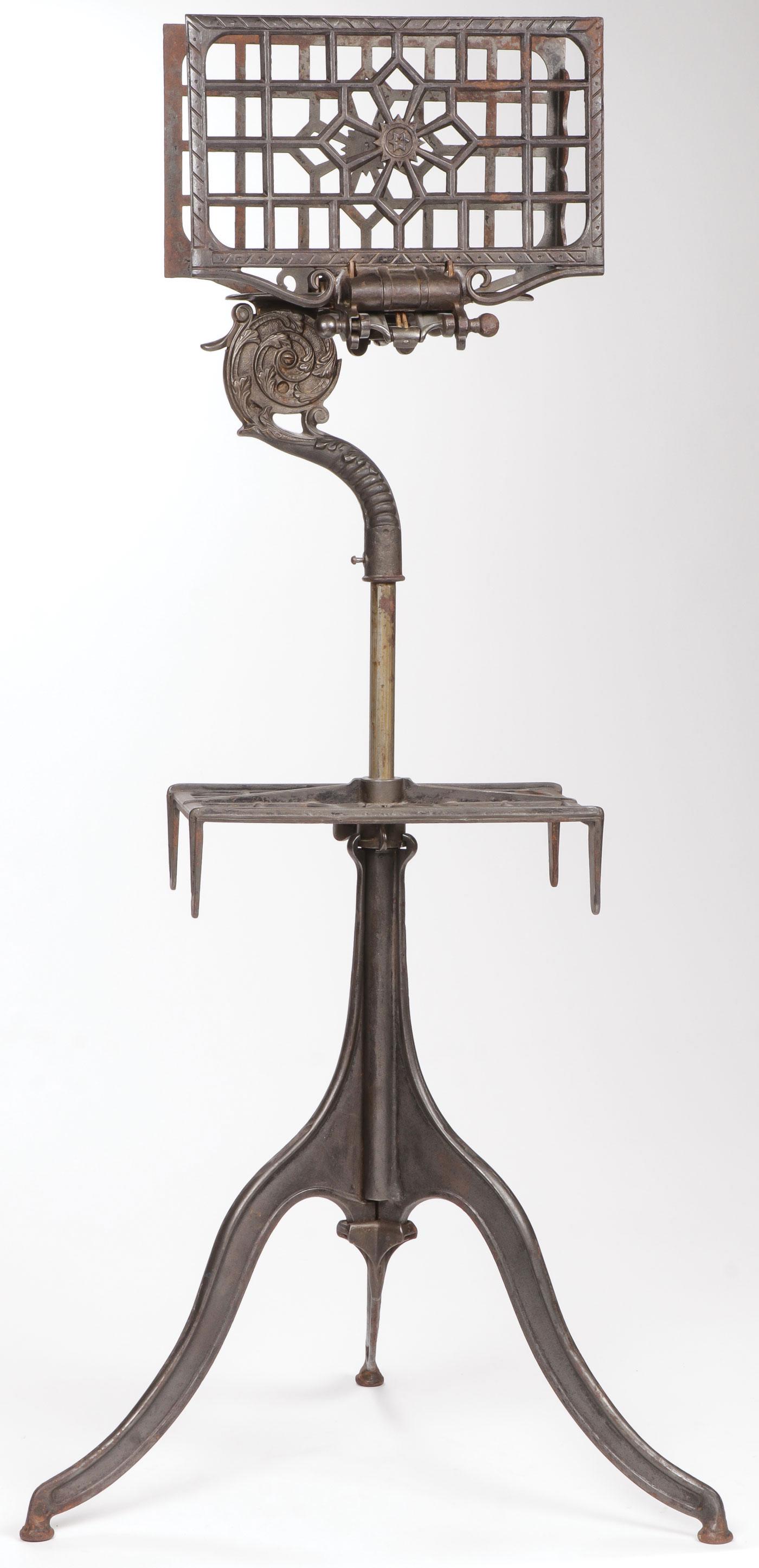 CAST IRON DICTIONARY STAND: CAST IRON DICTIONARY STAND. Of traditional form with adjustable height and ornate gooseneck brace. Current height 37.25 inches.SHIPPING NOTICE:Jackson's is your sole and only source for one stop pac