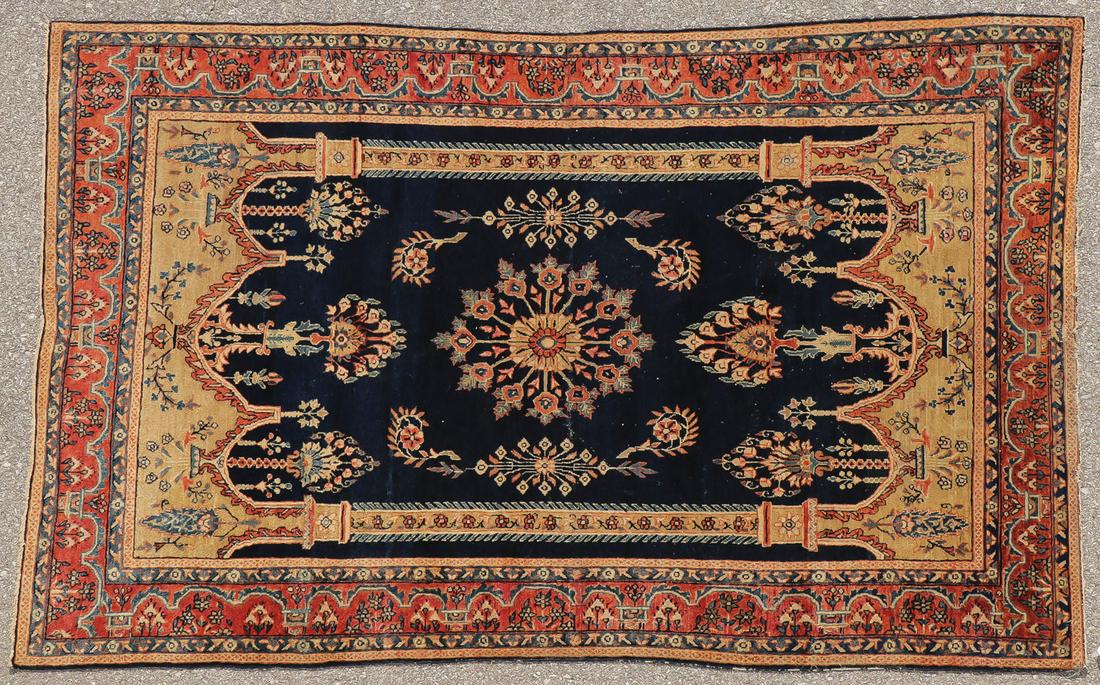 FINE ANTIQUE PERSIAN FEREGHAN SAROUK CIRCA 1920: FINE ANTIQUE PERSIAN FEREGHAN SAROUK CIRCA 1920. The navy field depicting a tan mihrab design with two columns and stylized geometric and floral embellishments throughout, having a soft red border, 6
