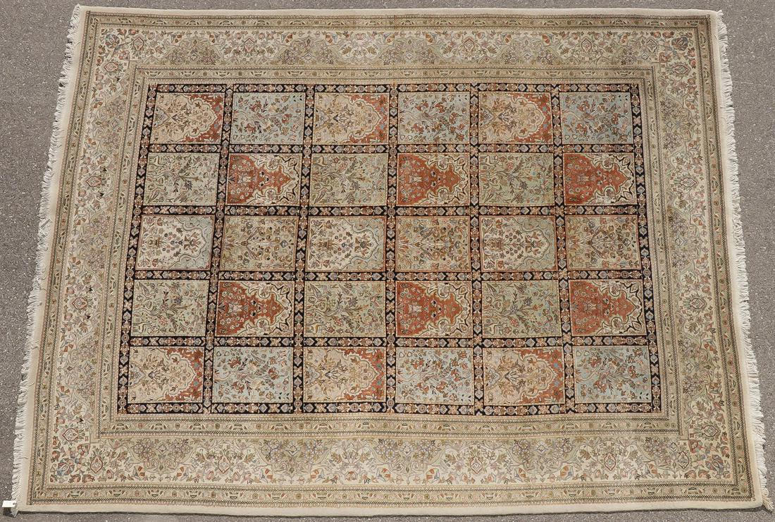 LARGE HANDWOVEN "TABA" TABRIZ RUG: LARGE HANDWOVEN "TABA" TABRIZ RUG. Of panel design in soft tones of rust, blue, and green on ivory ground, the ivory border with overall floral motif, 10 feet x 12 feet 10 inches. SHIPPING NOTICE: Jac