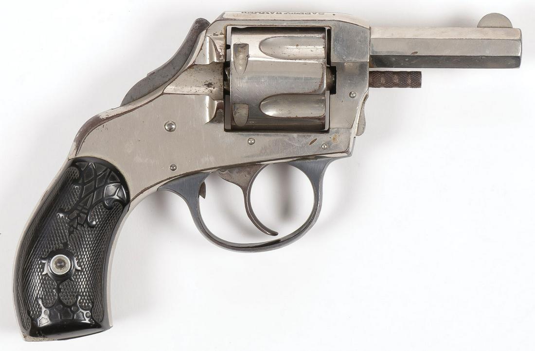 AN H. & R. SAFETY HAMMER D.A. REVOLVER: AN H. & R. SAFETY HAMMER D.A. REVOLVER. In .38 caliber, nickel plated, blued trigger guard, plastic grips, no serial number, together with a box of vintage Western 38 caliber ammunition. REQUIRES FFL 