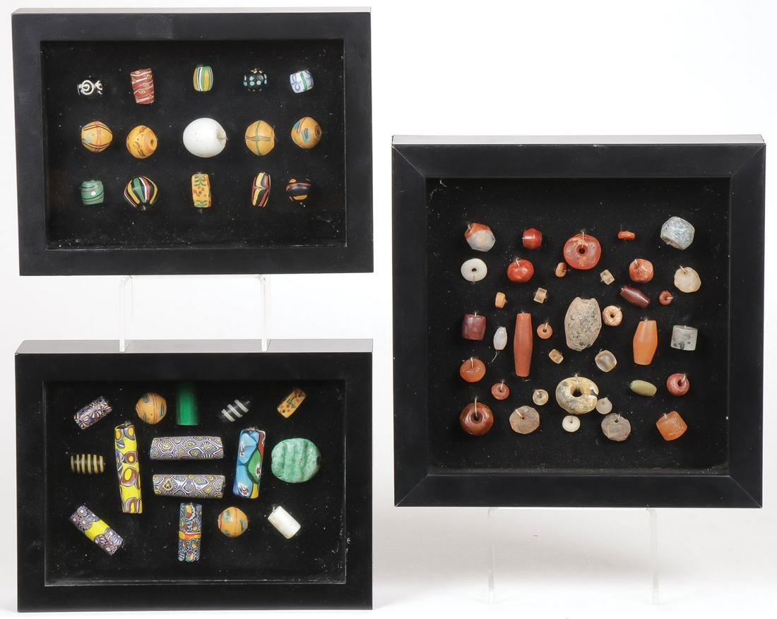 GROUP OF VINTAGE TRADE BEADS: GROUP OF VINTAGE TRADE BEADS. Comprising three professionally framed groups of various trade bead specimens featuring a good variety of types and materials, as shown. Largest frame 8 inches square.SHI
