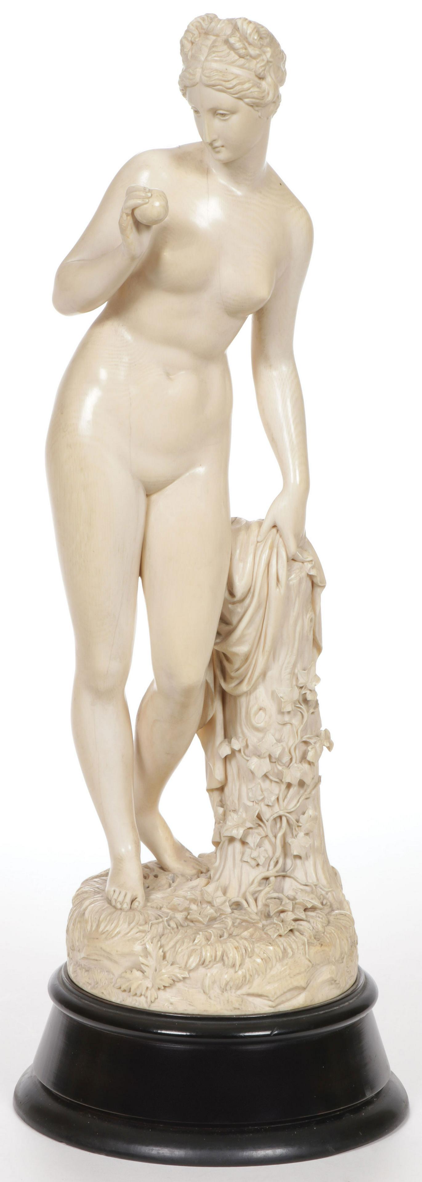 A SPECTACULAR LARGE CARVING OF VENUS 19TH C: A SPECTACULAR LARGE CARVING OF VENUS 19TH C., PROBABLY DIEPPE or GERMAN Comprising a large and impressive finely carved figure of Venus disrobing for her bath and holding an apple. Carved in full roun