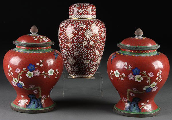 3 CHINESE CLOISONNÉ BRONZE COVERED JARS, C 1900: THREE CHINESE CLOISONNÉ BRONZE COVERED JARS, CIRCA 1900. Comprising two matching baluster form with scenic bluebird and cherry blossoms, together with an ovoid jar with all over ivory colored foliate