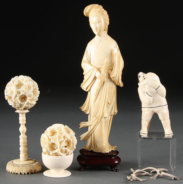 SIX-PIECE CARVED IVORY GROUP, 20TH CENTURY. : A SIX-PIECE CARVED IVORY GROUP, 20TH CENTURY. Comprising an Eskimo carved whale's tooth, a Chinese carved ivory Quan Yin (losses), two mystery puzzle balls (one on a stand) and a turned Continental fo