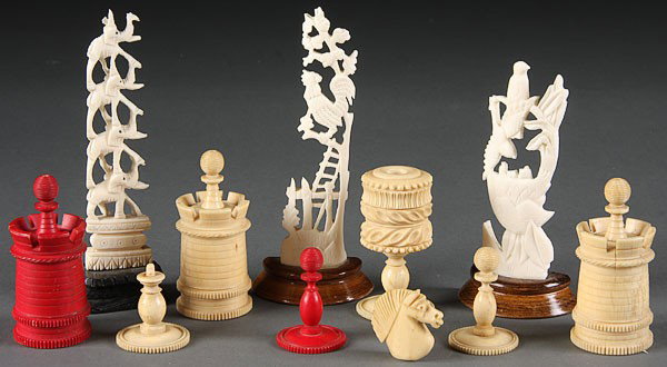 10-PC GROUP OF ORIENTAL & CONTINENTAL CARVED IVORY: A TEN-PIECE GROUP OF ORIENTAL AND CONTINENTAL CARVED IVORY, comprising three carved ivory partial tusks with reticulated scenes, six chess pieces and a carved container raised on pedestal foot. The la