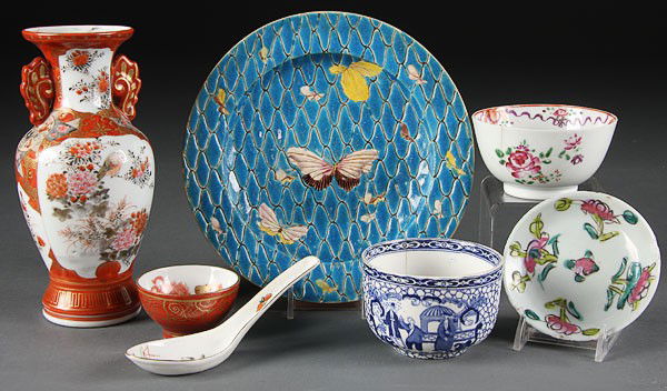 7-PC GROUP OF CHINESE AND JAPANESE PORCELAIN: A SEVEN-PIECE GROUP OF CHINESE AND JAPANESE PORCELAIN, consisting of an enamel blue plate with butterflies, a Kutani vase and sake cup, an early 19th century blue/white export tea cup and famille rose