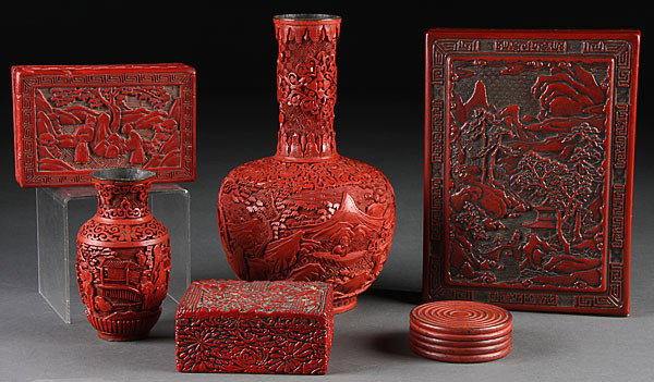 A SIX-PIECE CHINESE CARVED CINNABAR COLLECTION, 1: A SIX-PIECE CHINESE CARVED CINNABAR COLLECTION, 19TH/EARLY 20TH CENTURY. Comprising two (19th century) carved scenic vases, a lidded stationary box, two smaller boxes and a seal ink box. The largest 9