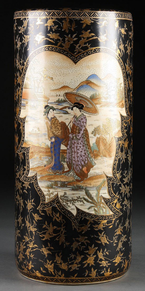 A JAPANESE SATSUMA UMBRELLA STAND/ FLOOR VASE, MI: A JAPANESE SATSUMA UMBRELLA STAND/ FLOOR VASE, MID 20TH CENTURY. Depicting Geisha and pavilions with Mount Fuji in background within two leaf form cartouches reserved on a black ground with gilt cherr