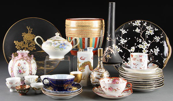 A JAPANESE DECORATIVE PORCELAIN GROUP, EARLY TO M: A JAPANESE DECORATIVE PORCELAIN GROUP, EARLY TO MID-20TH CENTURY. 39 pieces including hand painted Nippon, a Noritake cake set, sake set, a gilt on black ground scenic Satsuma signed charger, and a Sa