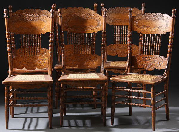 6 VERY FINE VICTORIAN OAK PRESSED BACK SIDE CHAIRS: A SET OF SIX VERY FINE VICTORIAN OAK PRESSED BACK SIDE CHAIRS, with double pressed back panels joined by eight turned spindles above a woven caned seat. Height 42 inches, width 19 inches, depth 17 inc