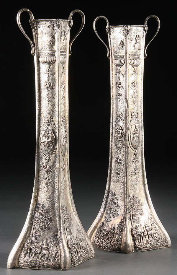 PR. BARBOUR SILVERPLATE HANDLED MANTLE VASES: A PAIR OF BARBOUR SILVERPLATE COMPANY HANDLED MANTLE VASES, CIRCA 1900 each with repoussed European style romantic scenes on a hammered ground. Height 17.5 inches (44.5 cm).