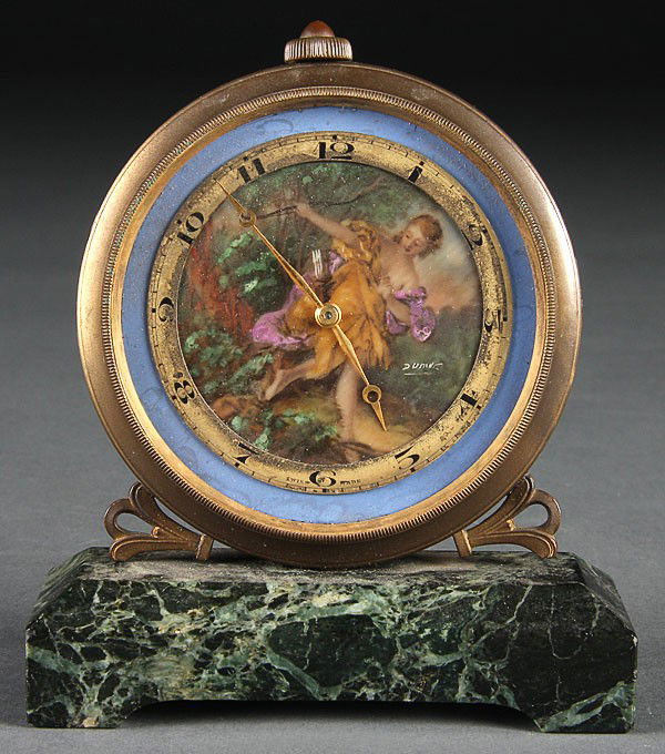 ATELIERS JUVENIA BRONZE AND MARBLE DRESSER CLOCK: AN ATELIERS JUVENIA BRONZE AND MARBLE DRESSER CLOCK, with hand painted dial depicting Diana. Crystal face detached. Height 4.5 inches (11.5 cm).