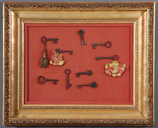 A COLLECTION OF NINE WROUGHT IRON CABINET KEYS, 1: A COLLECTION OF NINE WROUGHT IRON CABINET KEYS, 18TH CENTURY, of various size and form. Contained in a Victorian gilt molded gesso shadow box frame. 24 inches x 29.5 inches overall.