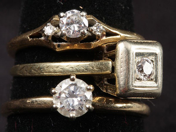THREE LADIES DIAMOND AND GOLD ENGAGEMENT RINGS, E: THREE LADIES DIAMOND AND GOLD ENGAGEMENT RINGS, EARLY TO MID 20TH CENTURY. Comprising an approximately .50 ct round brilliant cut diamond solitaire of approximately VS-VVS quality in good color, in an