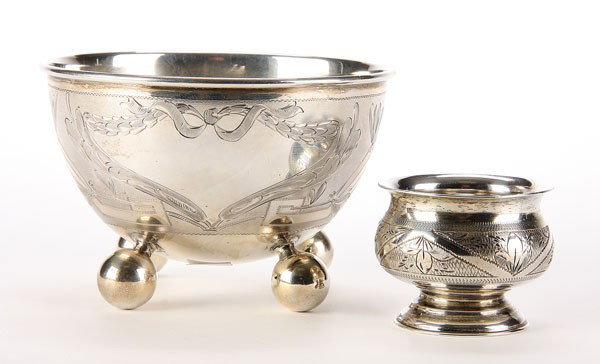AN IMPERIAL RUSSIAN SILVER MASTER SALT MOSCOW: AN IMPERIAL SILVER MASTER SALT, hallmarked Victor Savinkov 1876, Moscow, with chased foliates in Chevron framed panels, diameter 1.8 inches (4.8 cm), together with a Russian style Scandinavian footed 