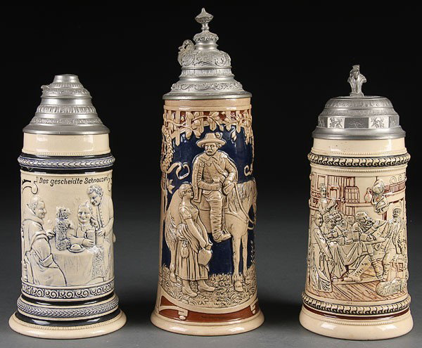 3 BEER STEINS GERMAN EMBOSSED: BEER STEINS, THREE GERMAN EMBOSSED AND POLYCHROME STONEWARE BEER STEINS, LATE 19TH/ EARLY 20TH CENTURY. Each with various drinking theme scenes. The largest depicting a gentleman on horseback with you