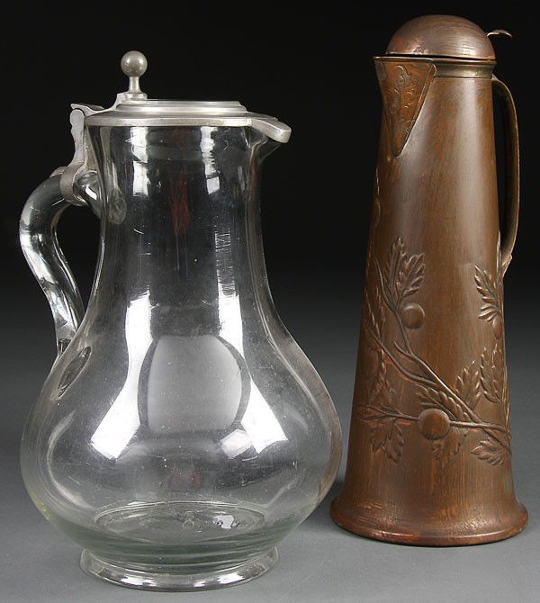 GERMAN OR AUSTRIAN BLOWN GLASS PEWTER JUG: A LARGE GERMAN OR AUSTRIAN BLOWN GLASS AND PEWTER MOUNTED JUG, of baluster form with squat bulbous base, applied glass handle and pewter lid with glass insert together with an arts and crafts embossed