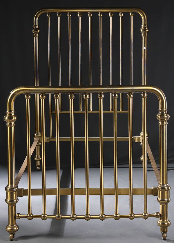 A VERY FINE PAIR OF MATCHING VICTORIAN BRASS BEDS: A VERY FINE PAIR OF MATCHING VICTORIAN BRASS BEDSTEADS, CIRCA 1900. Consisting of a tall headboard with nine ball decorated posts and matching bow front foot board. Height 61 inches, width 42.5 inches
