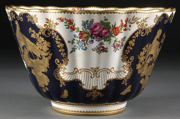 A LARGE BOOTHS ENGLISH PUNCH BOWL, CIRCA 1900: A LARGE BOOTHS ENGLISH PUNCH BOWL, CIRCA 1900, decorated with gilt exotic birds on cobalt blue ground with transfer florals. Diameter 12.25 inches (31 cm).