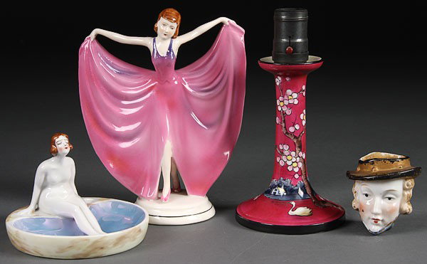 A JAPANESE ART DECO PORCELAIN GROUP, EARLY 20TH C: A JAPANESE ART DECO PORCELAIN GROUP, EARLY 20TH CENTURY. Four pieces comprising a Nippon electric candlestick, dancing figure, bathing beauty tray and head wall pocket. Height 3 inches to 8 inches.