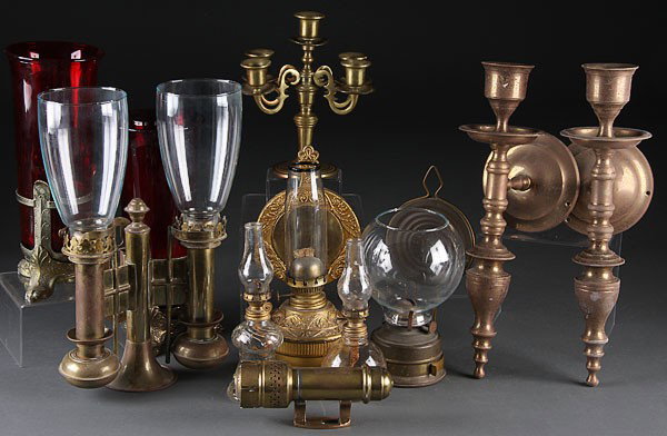 A DECORATIVE LIGHTING COLLECTION, 19TH/20TH CENTU: A DECORATIVE LIGHTING COLLECTION, 19TH/20TH CENTURY. Comprising two tall ruby shade vigil lamps, two Victorian miniature lamps, an embossed and gilt metal kerosene wall lamp, two large India brass can
