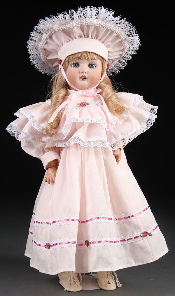 A SCHUTZMEISTER & QUENDT GERMAN BISQUE DOLL. Hei: A SCHUTZMEISTER & QUENDT GERMAN BISQUE DOLL. Height 21 inches.