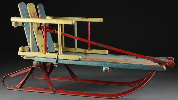 A CHILDS WOOD SLED, EARLY 20TH CENTURY. With pain: A CHILDS WOOD SLED, EARLY 20TH CENTURY. With painted wood slats on iron runners. Length 28 inches.