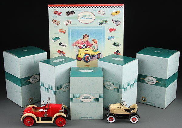 FIVE HALLMARK "KIDDIE CAR CLASSICS," LATE 20TH CE: FIVE HALLMARK "KIDDIE CAR CLASSICS," LATE 20TH CENTURY. Comprising a 1937 Garton Ford, 1929 Roadster, 1935 Murray and two 1926 Speedsters, all in boxes; together with a "Winner's Circle" product poste