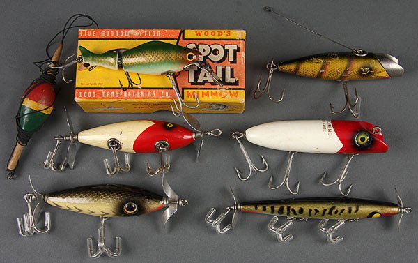 FIVE VINTAGE WOODEN FISHING LURES, EARLY TO MID-2: FIVE VINTAGE WOODEN FISHING LURES, EARLY TO MID-20TH CENTURY. Comprising a South Bend "Bass-Oreno" and "Fish-Oreno," two unmarked lures including a Winchester style spinner with glass eyes. Together w