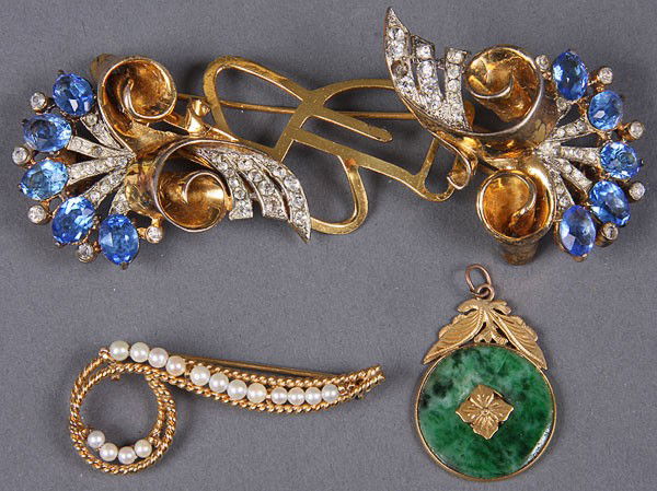 A DECORATIVE JEWELRY GROUP: A DECORATIVE JEWELRY GROUP: three pieces comprising a 2-section Coro "Douette" sterling convertible brooch, a gold filled and seed pearl scroll pin and a Chinese spinach jade "Bi" disc pendant with un