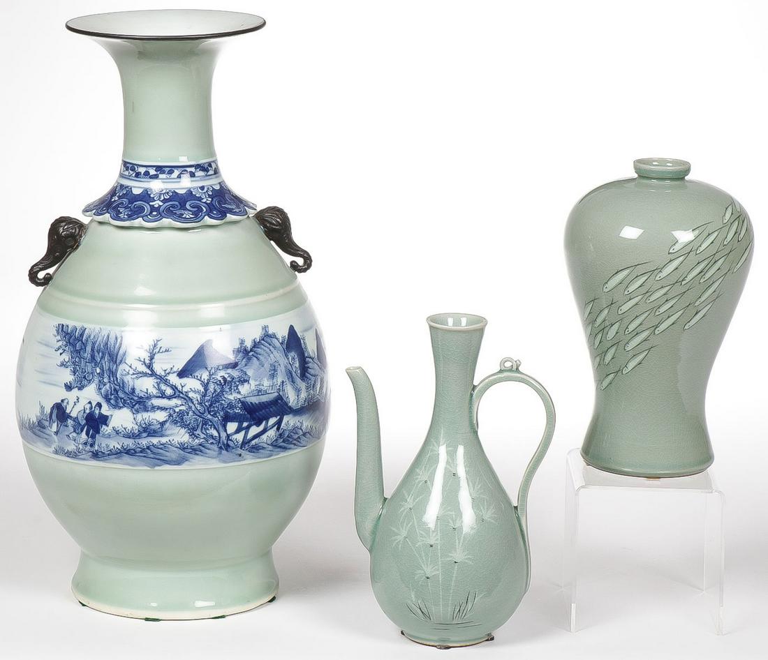 CELADON ASIAN PORCELAIN: CELADON ASIAN PORCELAIN. Comprising a celadon glazed ewer with crackle finish over bamboo decorated body on ring foot, signed on underside of base. Together with a baluster form vase decorated with f